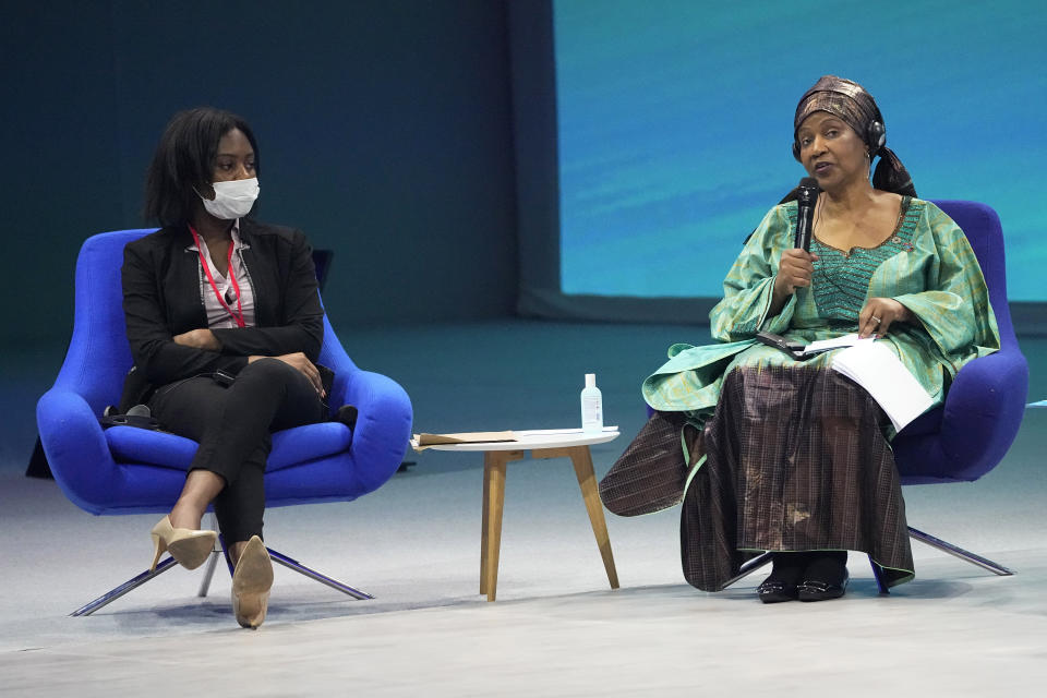 UN Women's Executive Director Phumzile Mlambo-Ngcuka, right, delivers her speech next to Shantel Marekera, founder of "Little Dreamers Foundation" during an international conference aims to fast-track the road to gender equality and mobilize millions of dollars to achieve the long-sought goal quickly, at the Louvre Carrousel in Paris, France, Wednesday, June 30, 2021. UN Women's Executive Director Phumzile Mlambo-Ngcuka said in an interview with The Associated Press that the underfunding of women's programs and the slow implementation of a 150-platform to achieve gender equality adopted by the world's nations in Beijing in 1995 "leaves a lot of women in a situation where they will never really realize their true and full potential." (AP Photo/Michel Euler)