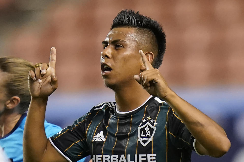 Los Angeles Galaxy midfielder Efrain Alvarez celebrates after scoring against the Vancouver Whitecaps in the second half during an MLS soccer match Wednesday, June 23, 2021, in Sandy, Utah. (AP Photo/Rick Bowmer)