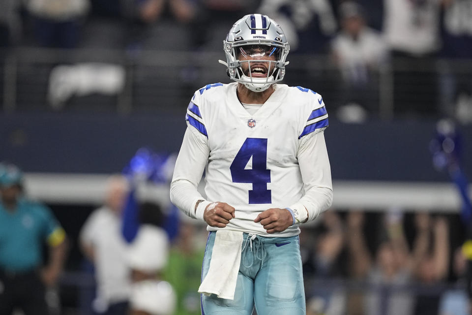 Dallas Cowboys quarterback Dak Prescott (4) reacts after a pass was ruled incomplete during the second half of an NFL football game against the Houston Texans, Sunday, Dec. 11, 2022, in Arlington, Texas. (AP Photo/Tony Gutierrez)