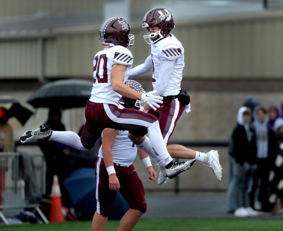 Unity's Aiden Porter, left, and Jay Saunders celebrate Saunders' touchdown during the game against Williamsville Saturday, Oct. 28, 2023.