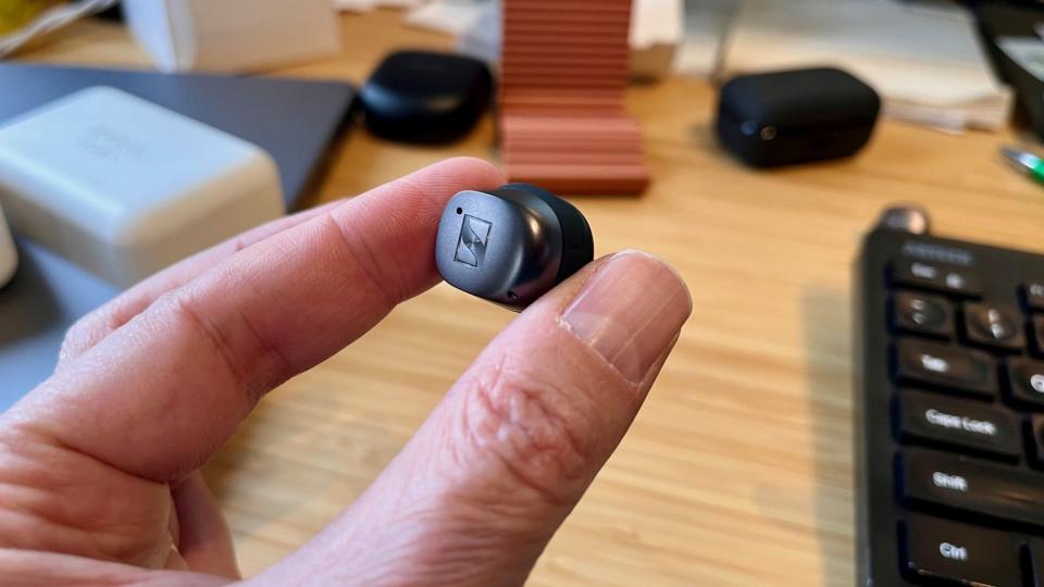 A close-up of one True Wireless 4 earbud.