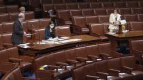 Members of U.S. House of Representatives gather to vote on $484 billion coronavirus relief bill on Capitol Hill in Washington