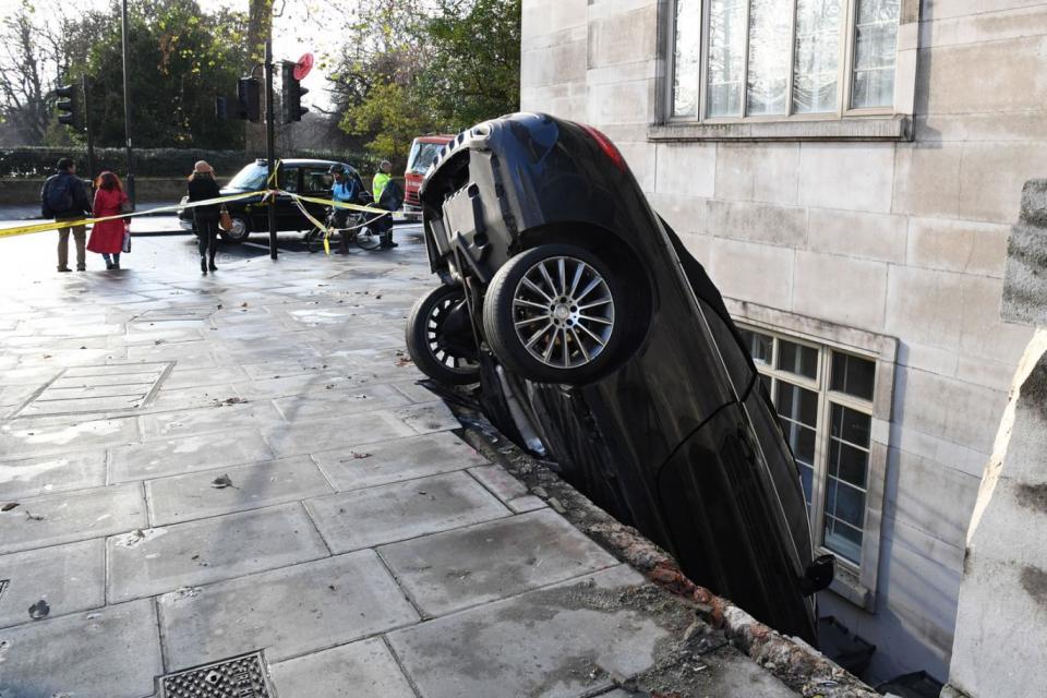 Crash barrier: the car plunged through railings and down into a lightwell (PA)