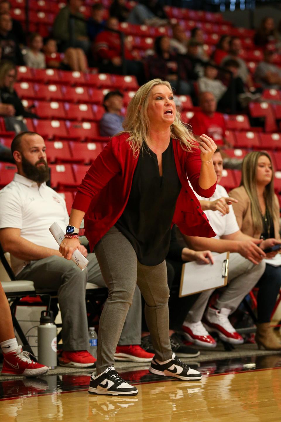 Nixa High School Lady Eagles Head Coach Jennifer Perryman encourages her players during the Pink & White Lady Basketball Classic semifinals at the O'Reilly Family Event Center on Thursday, Dec. 29, 2022.