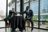 CORRECTS THAT HORST IS AT LEFT -Milwaukee Bucks general manager Jon Horst, left, shakes hands with new head coach Adrian Griffin at a news conference Tuesday, June 6, 2023, in Milwaukee. (AP Photo/Morry Gash)