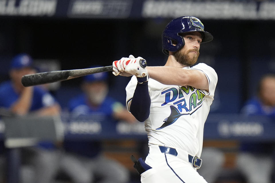 Tampa Bay Rays' Brandon Lowe watches his grand slam off Toronto Blue Jays starting pitcher Chris Bassitt during the third inning of a baseball game Friday, March 29, 2024, in St. Petersburg, Fla. (AP Photo/Chris O'Meara)