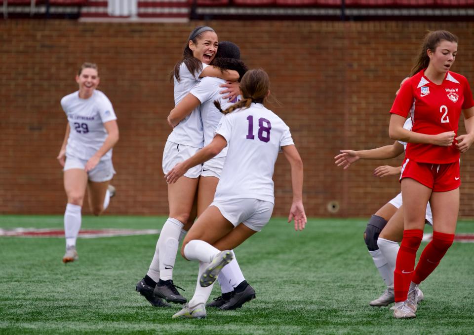 Isabella Veljacic (left) is hugged by a teammate after scoring a goal in the first half which proved to be the decisive strike in Cal Lutheran's 1-0 win over Washington University in the NCAA Division III championship game on Dec. 2.