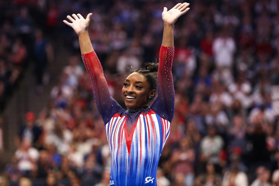 Simone Biles celebrates her floor routine during the U.S. Olympic Team Gymnastics Trials at Target Center.