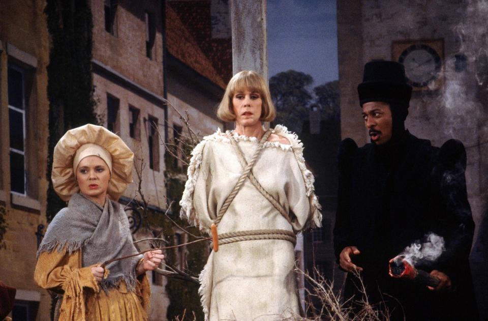 Meagen Fay, Carol Burnett, and Robert Townsend perform a burning at the stake sketch