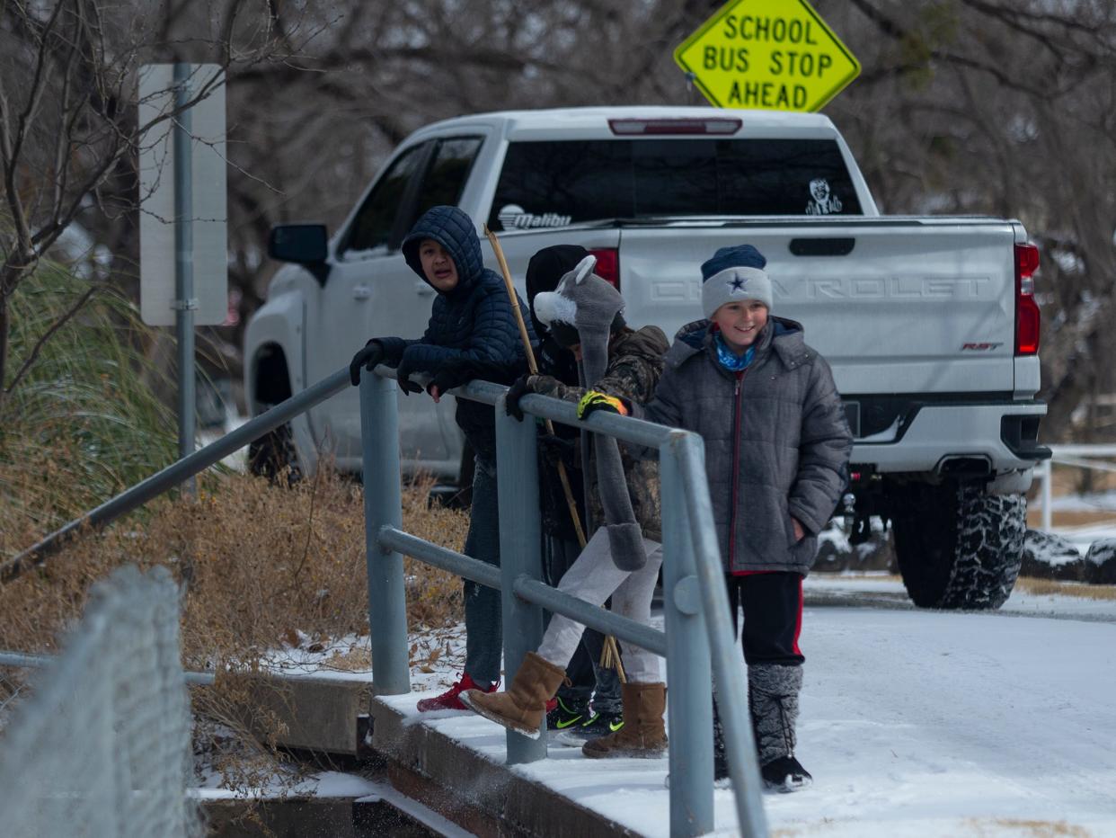 A group of San Angelo children near Lake Nasworthy enjoy a day off from school early Thursday morning. Many school districts canceled classes after a winter storm left the Concho Valley covered in ice and snow. Feb. 3, 2022