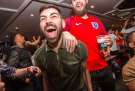 <p>These fans in Mooch Bar in Birmingham are all smiles at the result.<br> (Picture: SWNS) </p>