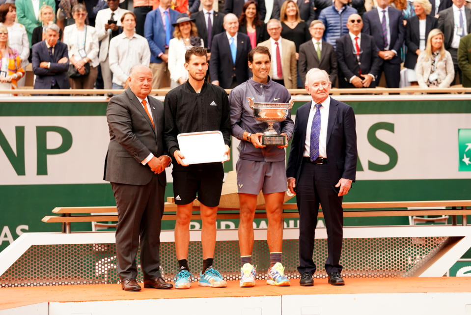 Tennis: French Open: (L-R) Federation Francaise de Tennis (FFT) president Bernard Giudicelli, Spain Rafael Nadal with Coupe des Mousquetaires trophy, Austria Dominic Thiem holding runner's up dish trophy, and Rod Laver on court after Men's Finals match vs at Stade Roland Garros. 
Paris, France 6/9/2019
CREDIT: Erick W. Rasco (Photo by Erick W. Rasco /Sports Illustrated via Getty Images)
(Set Number: X162706 TK16 )