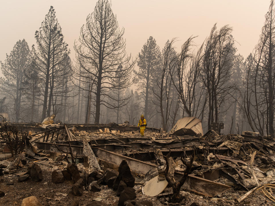 A Cal Fire firefighter assess damage at Ridgewood one week after the blaze destroyed Paradise, California. (Photo: Cayce Clifford for HuffPost)