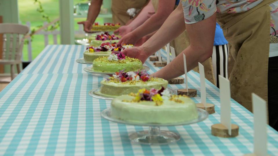 great british baking show bakers putting their desserts down during a technical bake