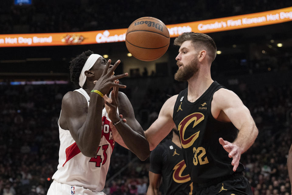 Toronto Raptors' Pascal Siakam (43) is fouled by Cleveland Cavaliers' Dean Wade during the first half of an NBA basketball game in Toronto, Monday, Nov. 28, 2022. (Chris Young/The Canadian Press via AP)