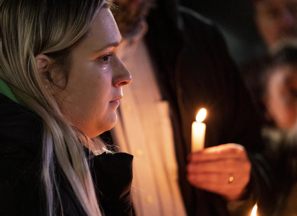 Rosalie List, a coworker at Richneck Elementary, wipes a tear from her eye while speaking during a vigil for Abby Zwerner, the teacher shot by a 6-year-old student at Richneck Elementary, in front of the Newport News Public Schools Administration Building on Monday, Jan. 9, 2023, in Newport News, Va. (Billy Schuerman/The Virginian-Pilot via AP)