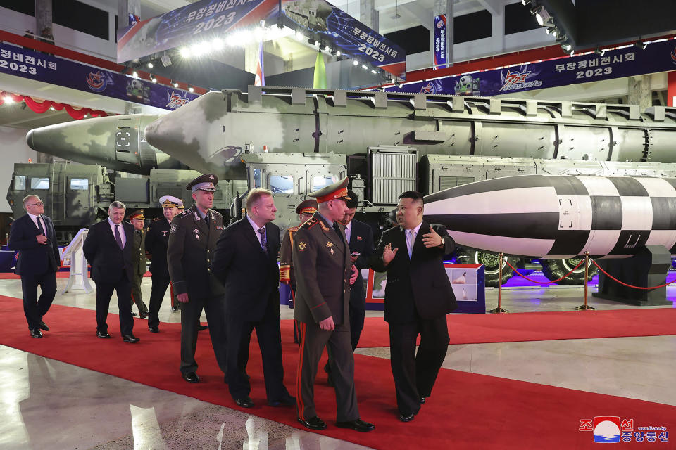 In this photo provided by the North Korean government, North Korean leader Kim Jong Un, right, with Russian delegation led by its Defense Minister Sergei Shoigu visits an arms exhibition in Pyongyang, North Korea Wednesday, July 26, 2023, on the occasion of the 70th anniversary of the armistice that halted fighting in the 1950-53 Korean War. Independent journalists were not given access to cover the event depicted in this image distributed by the North Korean government. The content of this image is as provided and cannot be independently verified. Korean language watermark on image as provided by source reads: "KCNA" which is the abbreviation for Korean Central News Agency. (Korean Central News Agency/Korea News Service via AP)