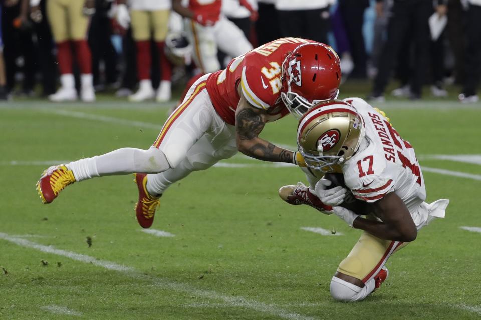 Kansas City Chiefs' Tyrann Mathieu (32) tackles San Francisco 49ers' Emmanuel Sanders (17) during the second half of the NFL Super Bowl 54 football game Sunday, Feb. 2, 2020, in Miami Gardens, Fla. (AP Photo/Seth Wenig)