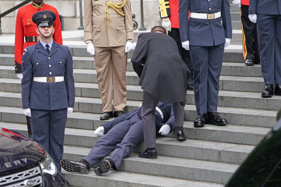 A military serviceman faints at St Paul’s Cathedral (Kirsty O’Connor/PA) (PA Wire)