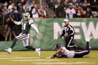 New York Jets quarterback Sam Darnold (14) avoids a hit from Houston Texans defensive end J.J. Watt (99) during the second half of an NFL football game, Saturday, Dec. 15, 2018, in East Rutherford, N.J. (AP Photo/Adam Hunger)