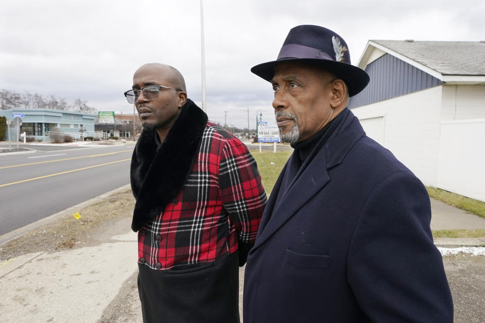 Brian Chaney, left, and his attorney Leonard Mungo stand near the area, Wednesday, Jan. 10, 2024, in Keego Harbor, Mich., where Chaney was arrested. The officer told Chaney he thought Chaney was breaking into cars and cuffed him. Chaney, who is Black, asked for a supervisor. The white officer told pointed to another officer from a different police department and told Chaney he was the supervisor. The Keego Harbor chief said in a deposition in a lawsuit Chaney filed that it's ok for his officers to lie when they are not under oath. (AP Photo/Carlos Osorio)