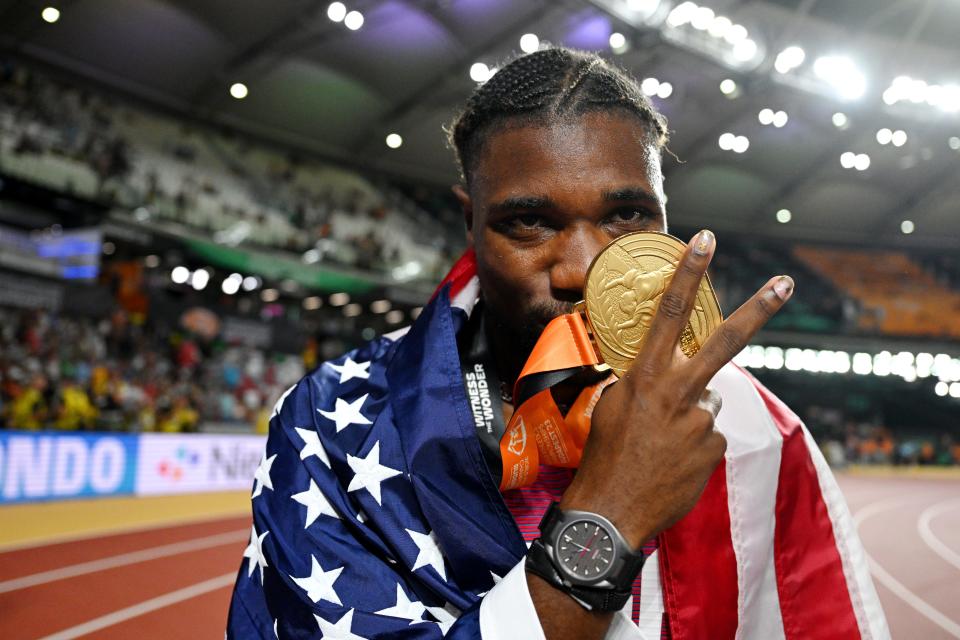 U.S. sprinter Noah Lyles celebrates winning the men's 200-meters final at the world championships.