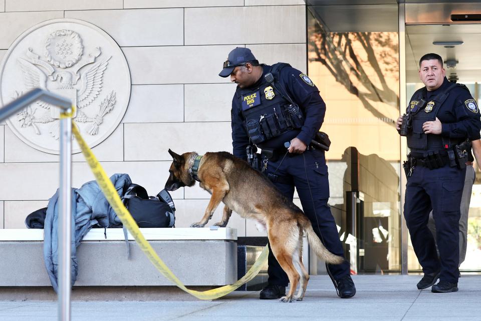 Federal police officers patrol with a dog in front of the federal courthouse where Hunter Biden is appearing on tax charges on January 11, 2024 in Los Angeles, California. Biden, the son of President Joe Biden, is being arraigned on the charges today.