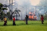 Many of the Muslim Rohingya fleeing Myanmar have brought with them stories of their villages being burned by mobs that they say include Buddhists