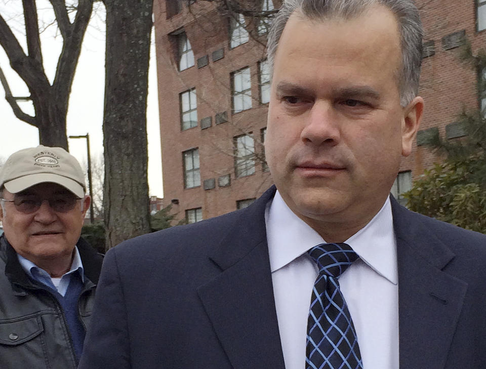 Rhode Island Democratic House Majority Leader Nicholas Mattiello, right, speaks to the media Sunday, March 23, 2014, in Providence, R.I. Mattiello is seeking the speaker of the House position after Gordon Fox Fox relinquished it Saturday following twin raids Friday at his Statehouse office and home, as part of a criminal investigation. Officials have not said whom or what they are investigating. A formal House vote is expected Tuesday. (AP Photo/Erika Niedowski)