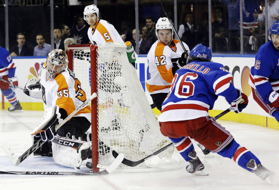 Philadelphia Flyers goalie Steve Mason (35) stops a shot on goal by New York Rangers' Mats Zuccarello (36) during the second period in Game 7 of an NHL hockey first-round playoff series on Wednesday, April 30, 2014, in New York. (AP Photo)