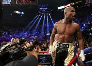 Floyd Mayweather, Jr. of the U.S. yells out to the crowd after defeating Manny Pacquiao of the Philippines in their welterweight WBO, WBC and WBA (Super) title fight in Las Vegas, Nevada, May 2, 2015. REUTERS/Steve Marcus