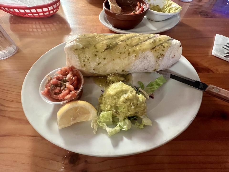Plate with fish burrito at restaurant