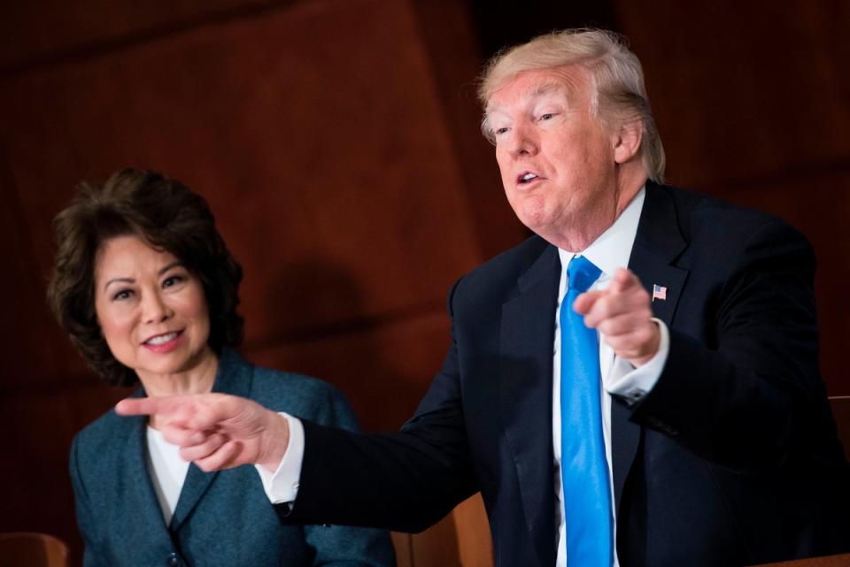 Chao and Trump at a roundtable discussion in Washington DC in June 2017 (AFP via Getty Images)