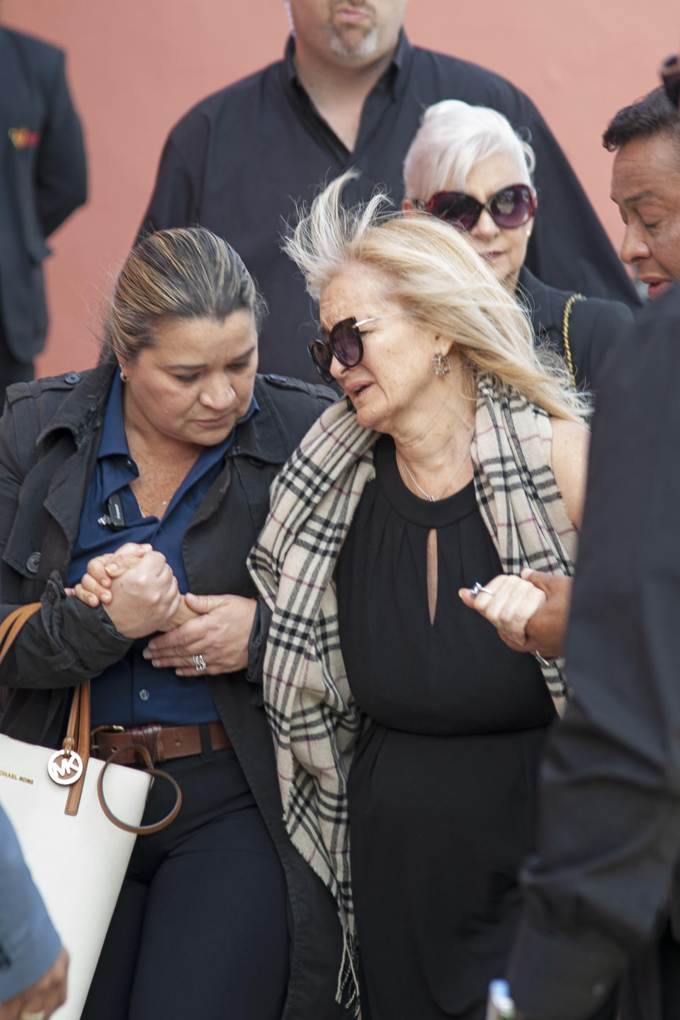 Sara Salazar, center, arrives to the funeral of her husband Mexican singer Jose Jose at the Miami Dade County Auditorium for a public viewing Sunday, October 6, 2019 in Miami. (AP Photo/Gaston De Cardenas)