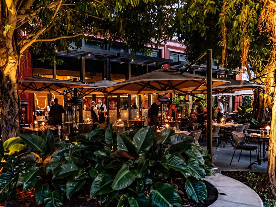 The leafy outdoor patio at Harry's restaurant and bar in downtown West Palm Beach offers a more intimate setting.