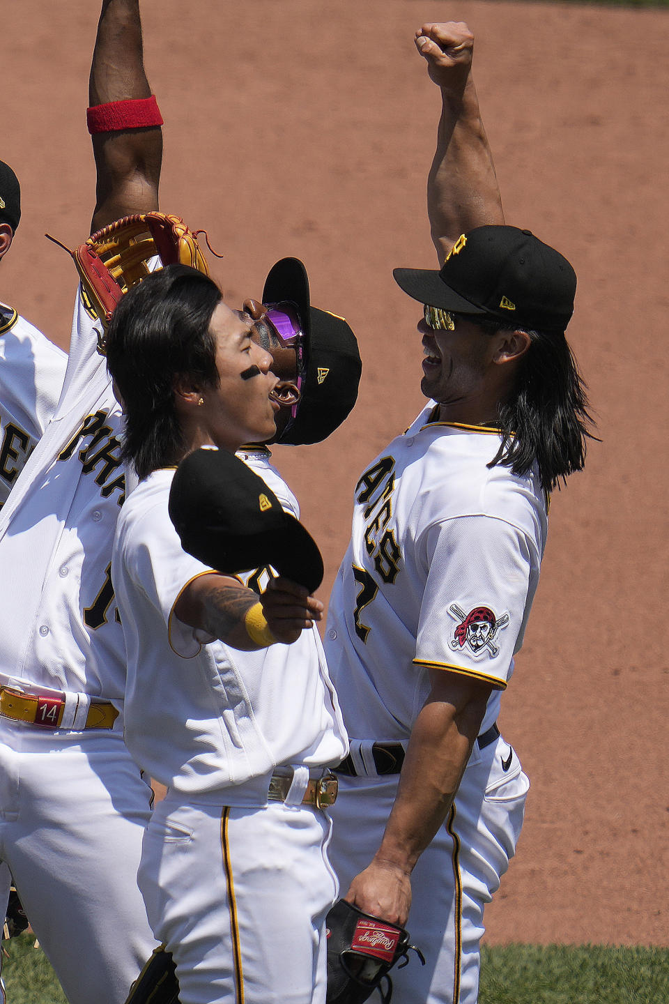 Pittsburgh Pirates' Ji Hwan Bae, left, celebrates with Connor Joe, right, after getting the final out of a 2-1 win over the St. Louis Cardinals at the end of a baseball game in Pittsburgh, Sunday, June 4, 2023. (AP Photo/Gene J. Puskar)