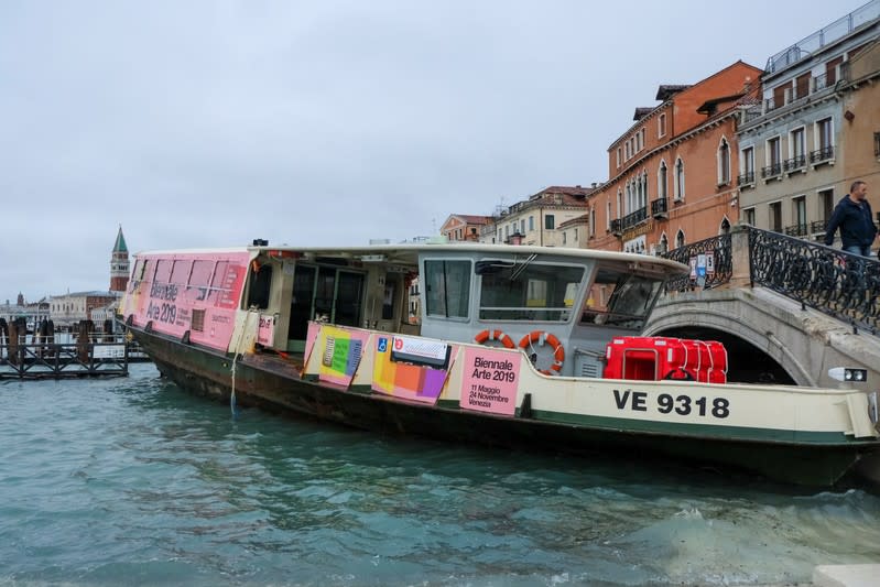 Vaporetto transported by the water after a night of record-high water levels is seen on the shore in Venice