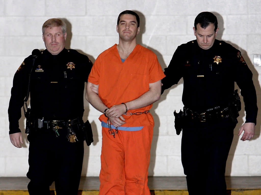 Convicted murderer Scott Peterson is escorted by San Mateo County Sheriff deputies as he is walked from the jail to an awaiting van, March 17, 2005 in Redwood City, California (REUTERS)