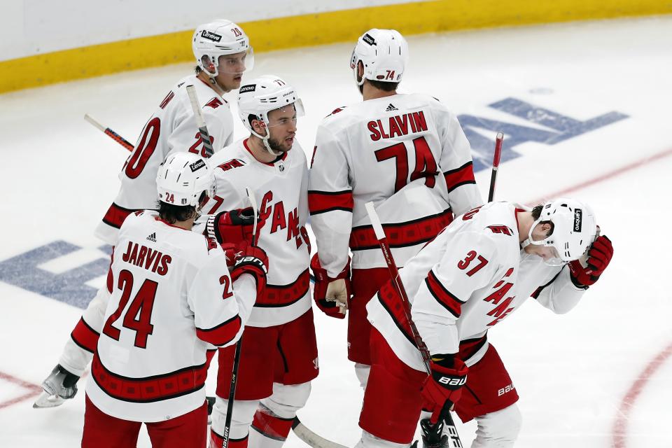 Carolina Hurricanes' Andrei Svechnikov (37) skates away after celebrating his goal against the Boston Bruins with teammates during the third period in Game 6 of an NHL hockey Stanley Cup first-round playoff series Thursday, May 12, 2022, in Boston. (AP Photo/Michael Dwyer)