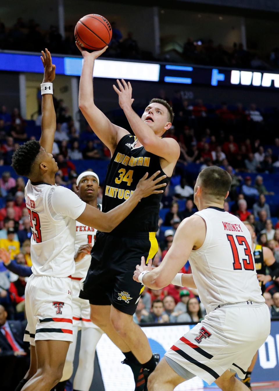 Northern Kentucky Norse forward Drew McDonald (34) attempts a shot in the first half of the NCAA Tournament First Round game between the 14-seeded Northern Kentucky Norse and the 3-seeded Texas Tech Red Raiders the BOK Center in downtown Tulsa on Friday, March 22, 2019. Texas Tech led 30-26 at halftime. 