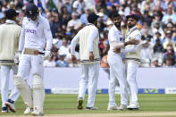 India's Jasprit Bumrah, second right, celebrates with teammates the dismissal of England's Zak Crawley, second left, during the fourth day of the fifth cricket test match between England and India at Edgbaston in Birmingham, England, Monday, July 4, 2022. (AP Photo/Rui Vieira)