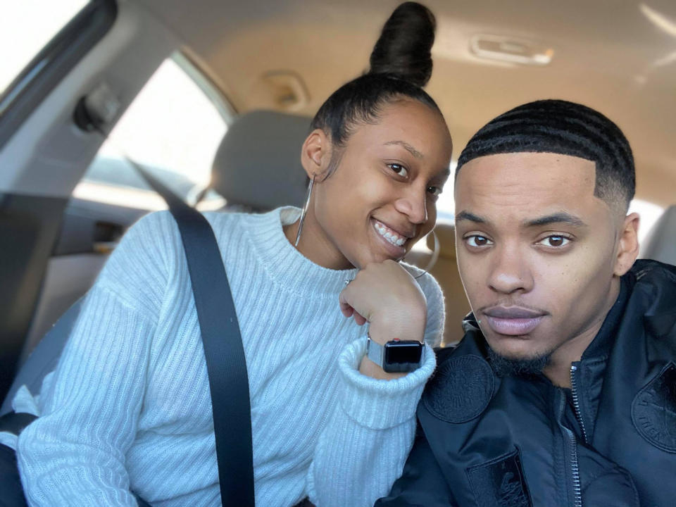 Bria Williams, 26, and her husband Adrian, 25, sitting in a car