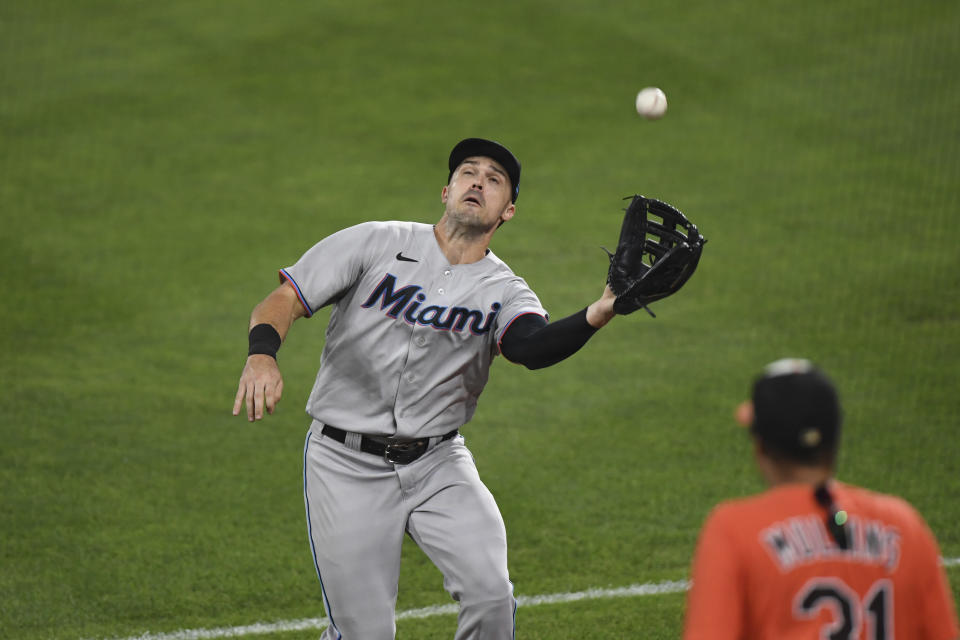 Miami Marlins right fielder Adam Duvall catches a foul ball hit by Baltimore Orioles' Ryan Mountcastle during the eighth inning of a baseball game Tuesday, July 27, 2021, in Baltimore. (AP Photo/Terrance Williams)