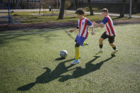 Children warm up during a soccer training session in Kyiv, Ukraine, Wednesday, March 27, 2024. Ukraine, Georgia and Poland are going to the 2024 European Championship after bringing late drama to win emotional qualifying playoffs on Tuesday. (AP Photo/Vadim Ghirda)