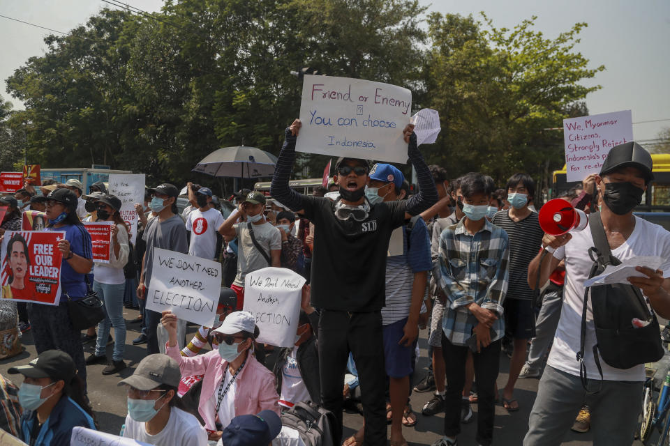 Demonstrators display placards during a protest close to Indonesian Embassy in Yangon, Myanmar, Tuesday, Feb. 23, 2021. Anti-coup protesters gathered outside the embassy following reports that Indonesia was seeking to have fellow members of the Association of Southeast Asian Nations to agree on an action plan over the Myanmar’s coup that would hold the junta to its promise to hold free and fair elections in a year’s time. (AP Photo)