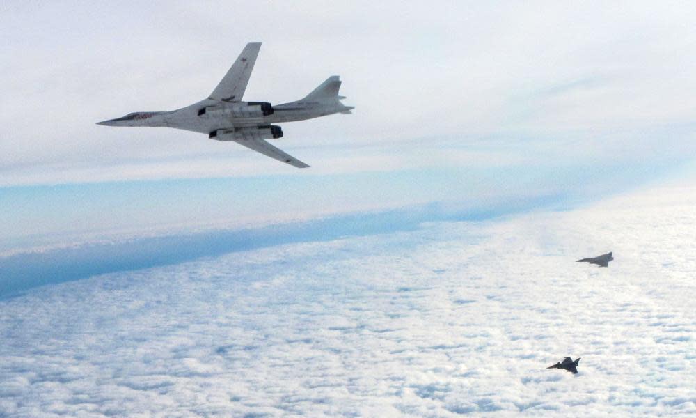 Two RAF Typhoon fighters escort a Russian TU-160 Blackjack bomber in February 2016.