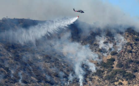 Firefighters continue to battle the Thomas fire , a wildfire near Fillmore, California, December 14, 2017.  REUTERS/Gene Blevins     TPX IMAGES OF THE DAY