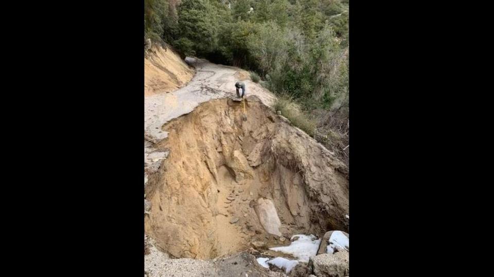 Retired National Parks Service employee Michael Botkin takes measurements in a sinkhole near Slapjack Creek on Feb. 2, 2023.