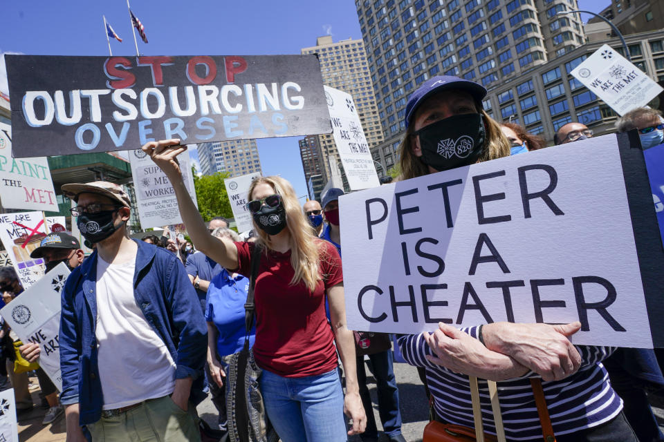 Union member demonstrators rally outside the Metropolitan Opera house during a "We Are the Met Rally," Thursday, May 13, 2021, in New York. Locked out stagehands and unions with contracts expiring this summer demonstrated outside the Met to protest the Opera's unfair treatment of workers, lockout of stagehands and the outsourcing of work. (AP Photo/Mary Altaffer)