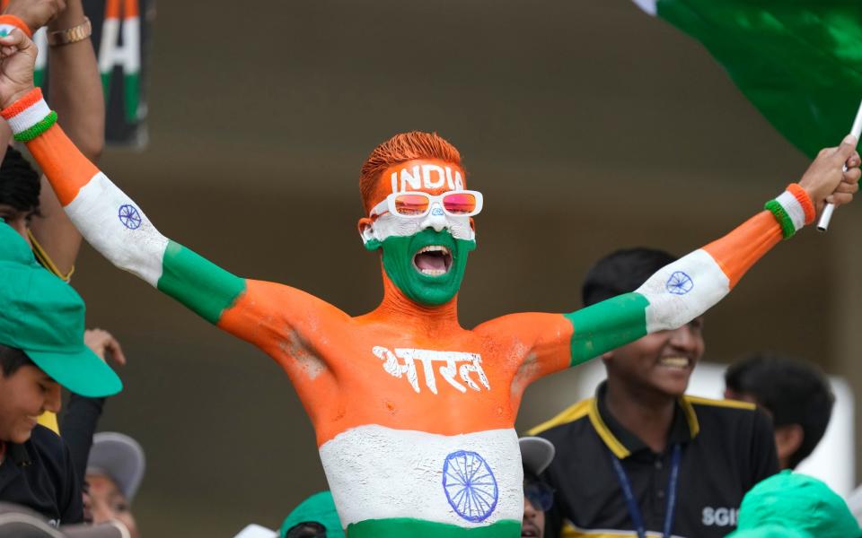 fan cheers for Indian team on the first day of the third cricket test match between India and England in Rajkot, India, Thursday, Feb. 15, 2024